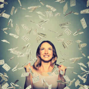 Woman throwing money in the air