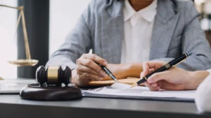 A creditors' rights lawyer sits at her desk in a law office.